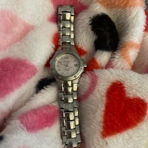 Seiko watch stainless steel band, pink mother of pearl face.